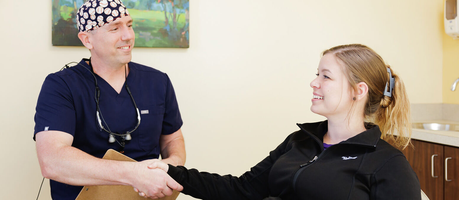 doctor speaking with patient at Spring Lake Oral Surgery